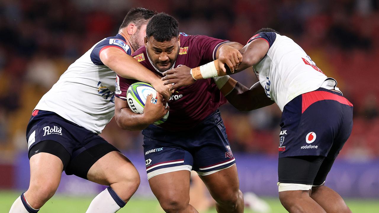 Taniela Tupou tries to barge his way through a Rebels tackle. Picture: Getty Images