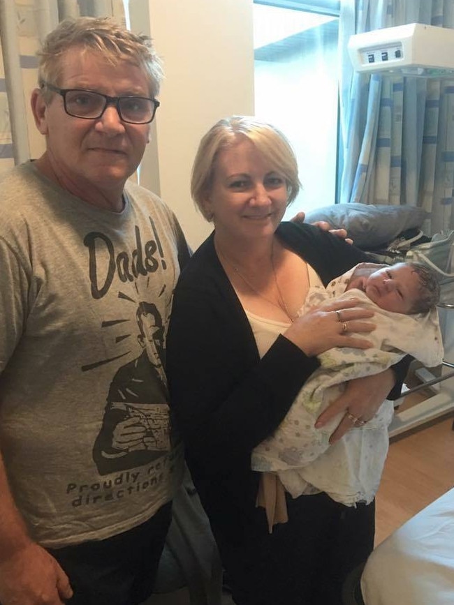 Coralee O'Rourke and her husband Lewis with their first grandson Noah.