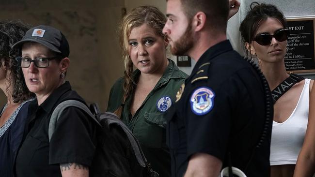 Emily Ratajkowski and comedian Amy Schumer are arrested during a protest against the confirmation of Supreme Court nominee Judge Brett Kavanaugh in Washington last month. Picture: Alex Wong/Getty Images