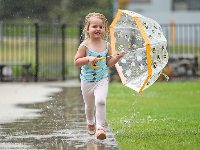 Maple Stranger, 3, plays in the rain early last month. Picture: Zak Simmonds