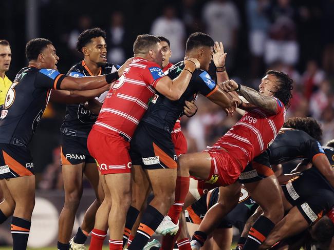 SYDNEY, AUSTRALIA - APRIL 14:  Players scuffle after a high tackle on Zac Lomax of the Dragons by David Klemmer of the Tigers during the round six NRL match between Wests Tigers and St George Illawarra Dragons at Campbelltown Stadium, on April 14, 2024, in Sydney, Australia. (Photo by Matt King/Getty Images)