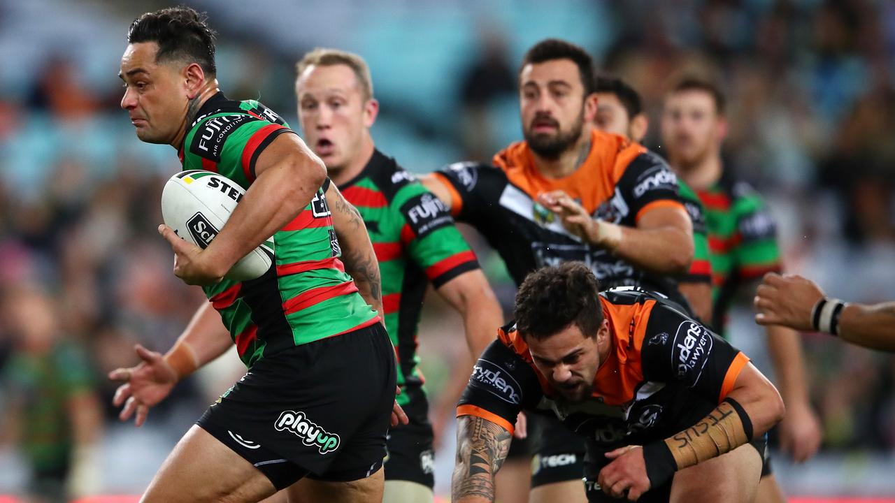 John Sutton busts the Wests Tigers line open with an explosive burst.