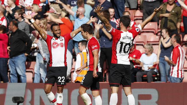 Southampton's English striker Charlie Austin (R) celebrates a win.