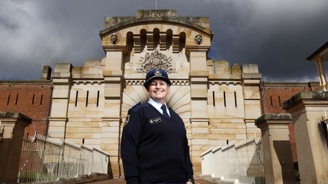 Bathurst Correctional Centre Governor Tracey-Lee Melrose outside the old sandstone facade and gate at the 1888 prison. Picture: Jonathan Ng