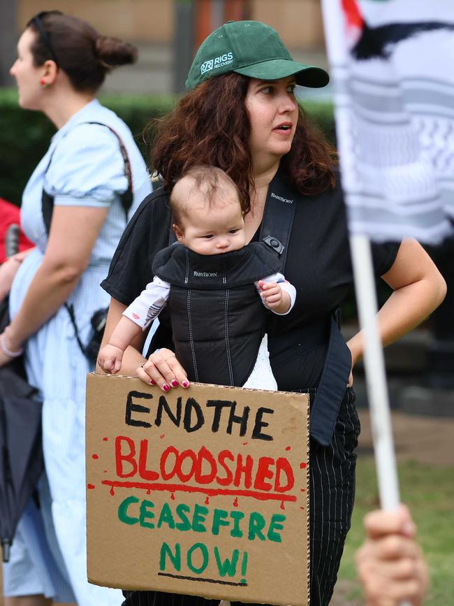 A woman and baby at Sunday’s rally. Picture: Tertius Pickard