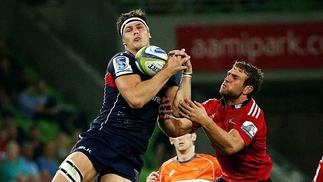 Super Rugby - Melbourne Rebels v Crusaders at AAMI Park .Luke Jones beats Luke Whitelock to the high ball. March 14th 2014 . Pic by Colleen Petch.