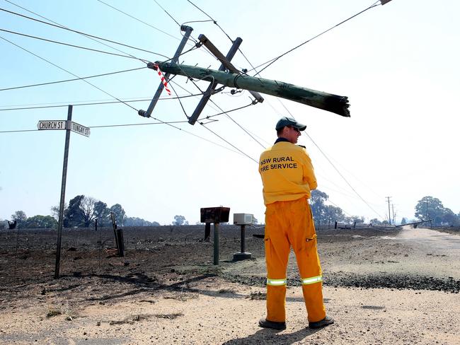 Disaster zone.... a power pole hangs dangerously in the air in Uarbry. Picture: Peter Lorimer.