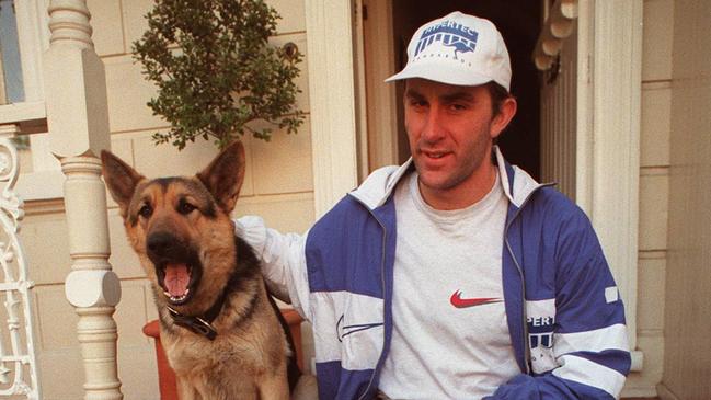 McKernan at home with his dog Serbie the night after the Brownlow Medal count.