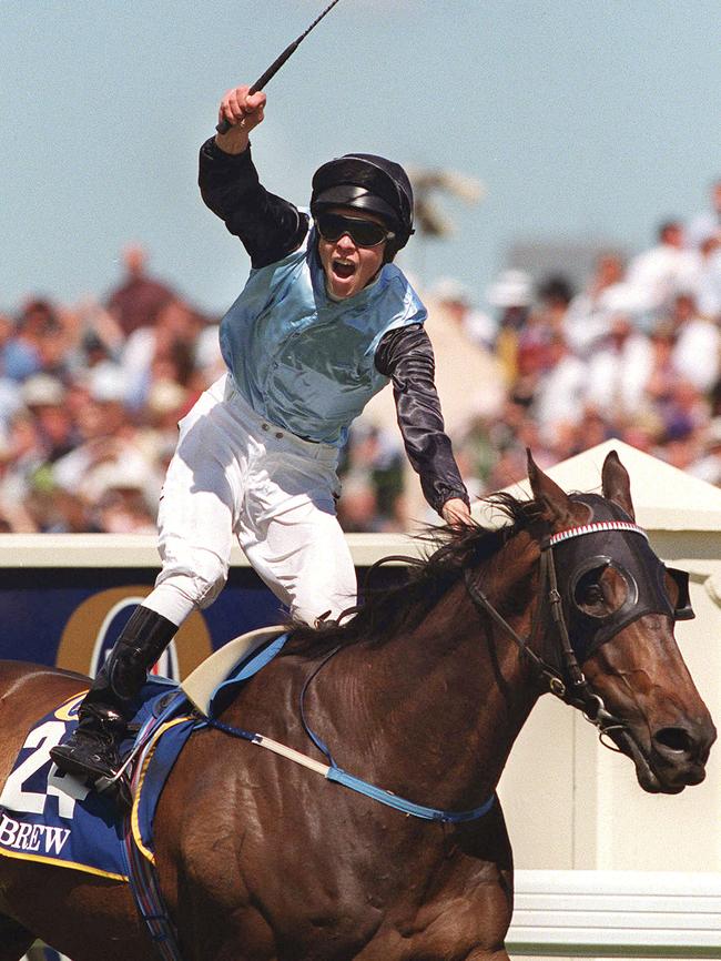 Kerrin McEvoy celebrates his Melbourne Cup win of 2000 on horse Brew.