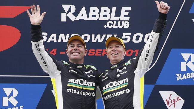 Craig Lowndes (left) and Steven Richards celebrate finishing in 3rd place after Race 24 of the 2018 Virgin Australia Supercars Championship at the Rabble.club Sandown 500. Picture: AAP Image/Daniel Pockett.