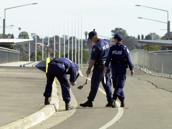 Security and police officers conducting security checks during the Sydney 2000 Olympic Games.