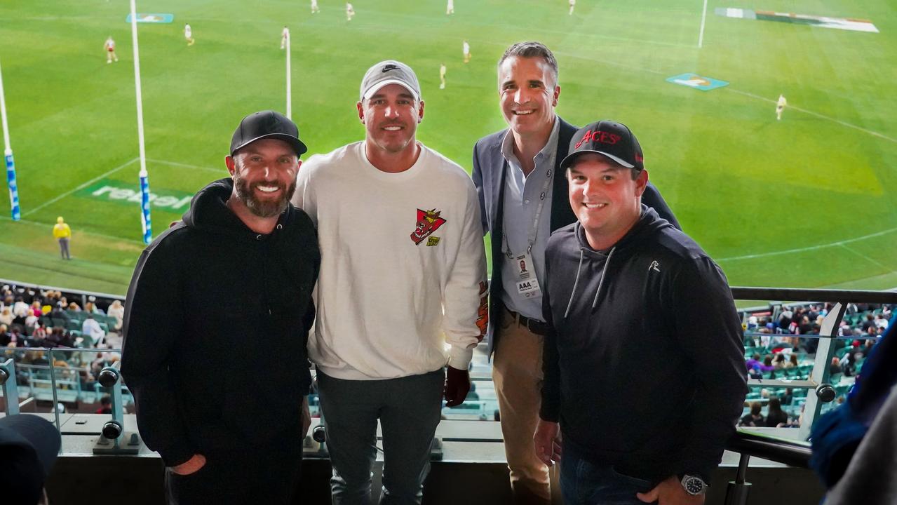 LIV golfers Dustin Johnson, left, Brooks Koepka and Patrick Reed with Premier Peter Malinauskas watching St Kilda v Collingwood match at Adelaide Oval.