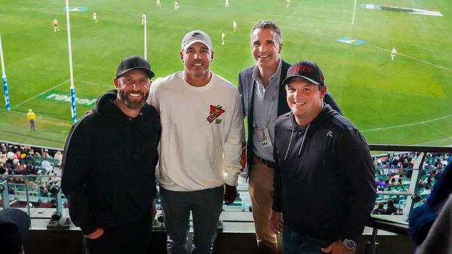 LIV golfers Dustin Johnson, left, Brooks Koepka and Patrick Reed with Premier Peter Malinauskas watching St Kilda v Collingwood match at Adelaide Oval.