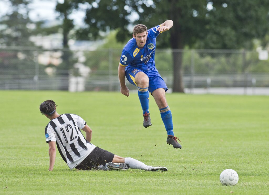 Matthew Meiklejohn, Willowburn and Jordan Moy, USQ. Football, Willowburn vs USQ. Sunday, 4th Mar, 2018. Picture: Nev Madsen