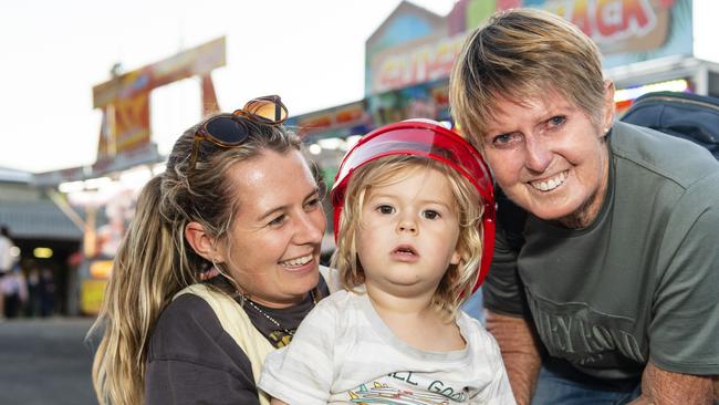 Kathleen Leggatt with son Koa Koland, 3, and mum Di Leggatt in sideshow alley at the Toowoomba Royal Show, Thursday, March 30, 2023. Picture: Kevin Farmer