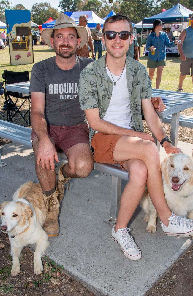 (From left) Sam Johnson and Jack Shelly with Fern and Sprocket at the Murphys Creek Chilli and Craft carnival. Sunday, September 22, 2024. Picture: Nev Madsen