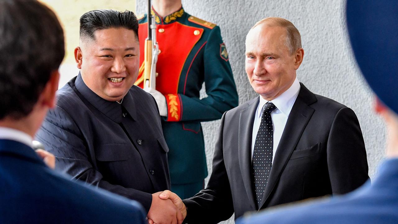 Russian President Vladimir Putin welcomes North Korean leader Kim Jong-un prior to their talks at the Far Eastern Federal University campus on Russky island in the far-eastern Russian port of Vladivostok on April 25, 2019. (Photo by Yuri KADOBNOV / AFP)