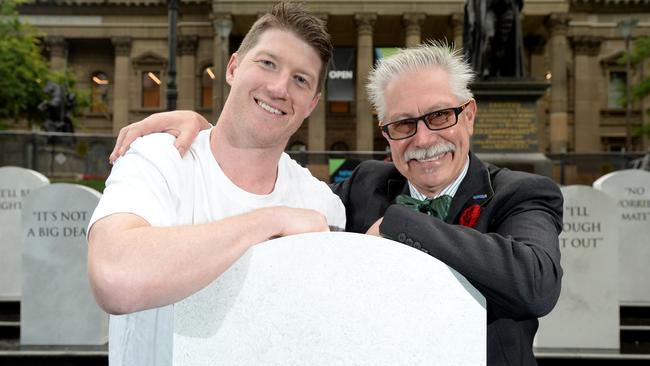 Former AFL footballer Sam Rowe, who has survived testicular cancer, and Bruce Whalley, star of ABC TV's Think Tank with tombstones to mark Movember. Picture: Andrew Henshaw