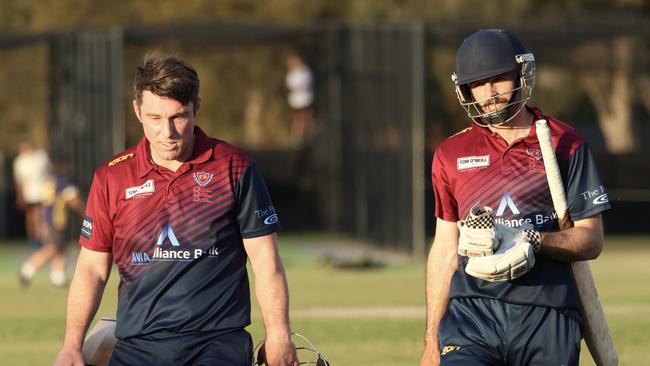 East Belmont's Danny Hegarty and Dylan Moroney walk off after claiming a two-wicket win over Highton. Picture: Russell McMahon.