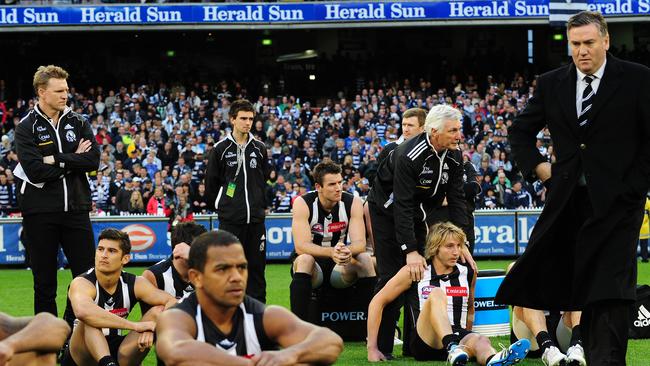 Buckley, Malthouse and McGuire after the 2011 Grand Final defeat.