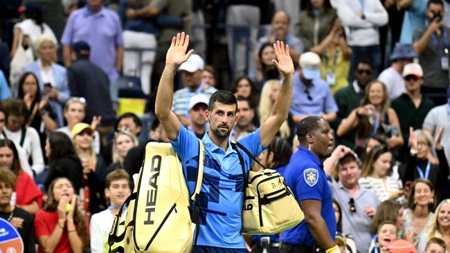 Djokovic waves goodbye to the New York crowd. (Photo by ANGELA WEISS / AFP)