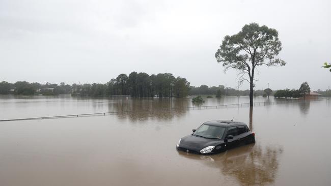 Floodwaters on Old Hawkesbury Road at McGraths Hill near Windsor. Picture: NCA NewsWire / Jeremy Piper