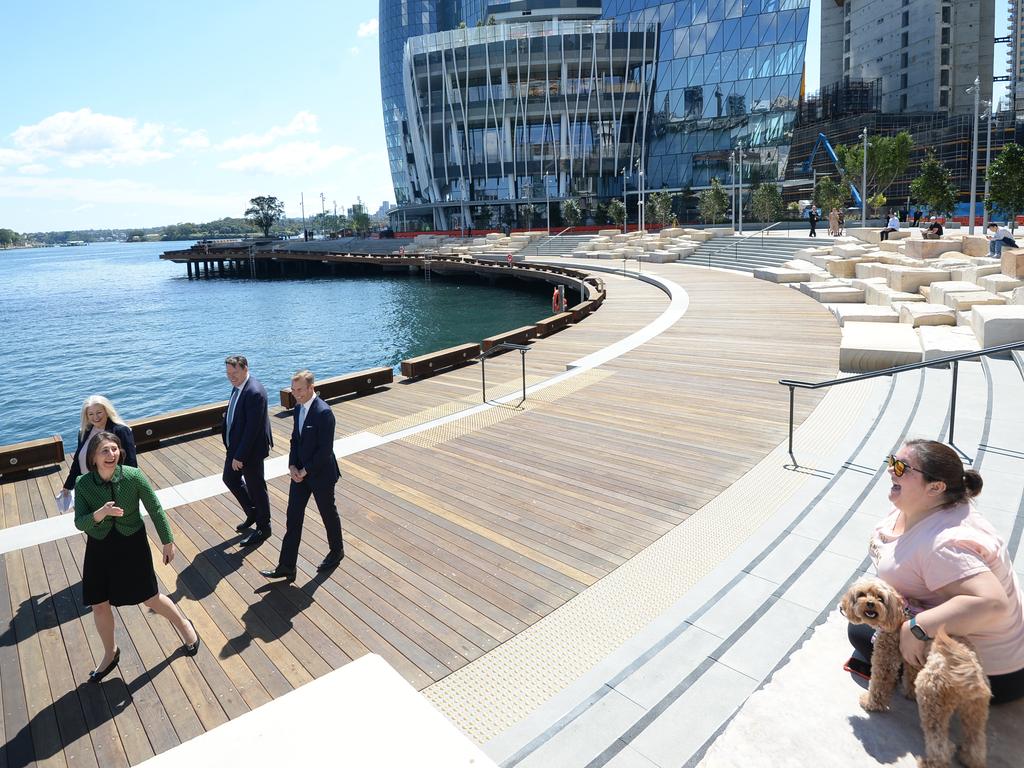 Premier Gladys Berejiklian greets a dog walker at Watermans Cove in Barangaroo. Picture: NCA NewsWire/Jeremy Piper