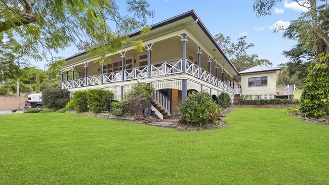 This five-bedroom house at 935 Tamborine-Oxenford Rd, Wongawallan, is on the market for offers over $1.79m.