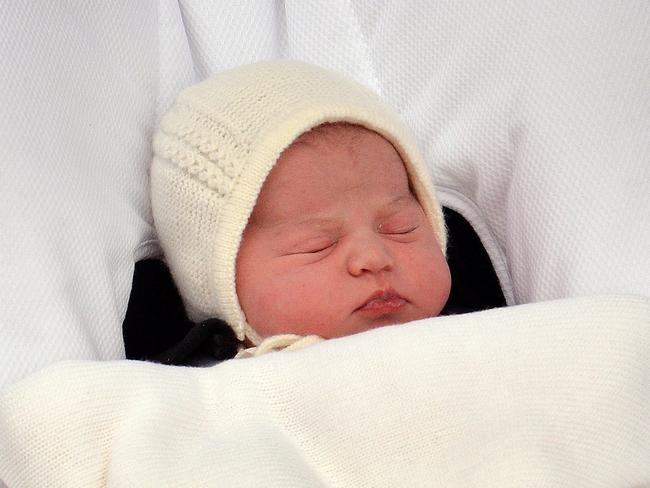 Britain's Prince William, Duke of Cambridge, carries his newly-born daughter, his second child with Catherine, Duchess of Cambridge, as they leave the Lindo Wing at St Mary's Hospital in central London, on May 2, 2015. The Duchess of Cambridge was safely delivered of a daughter weighing 8lbs 3oz, Kensington Palace announced. The newly-born Princess of Cambridge is fourth in line to the British throne. AFP PHOTO / POOL / JOHN STILLWELL