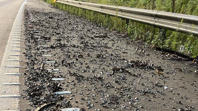 Hundreds of vehicles were left with punctured tyres after a truck carrying metal spilt onto the M1. Picture: Live Traffic NSW