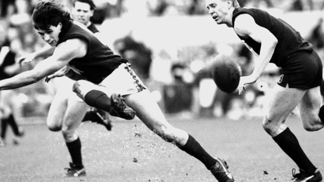 1990 Football State of Origin match Tasmania versus Victoria – Tasmanian captain Darrin Pritchard was the most prolific ball-winner on the day, gets his kick away.