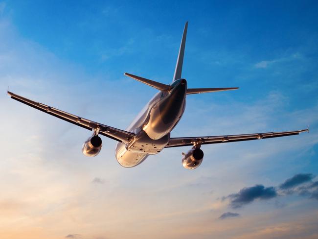 Airplane flying above tropical sea at sunset.Escape 11 August 2024Doc updatesPhoto - iStock