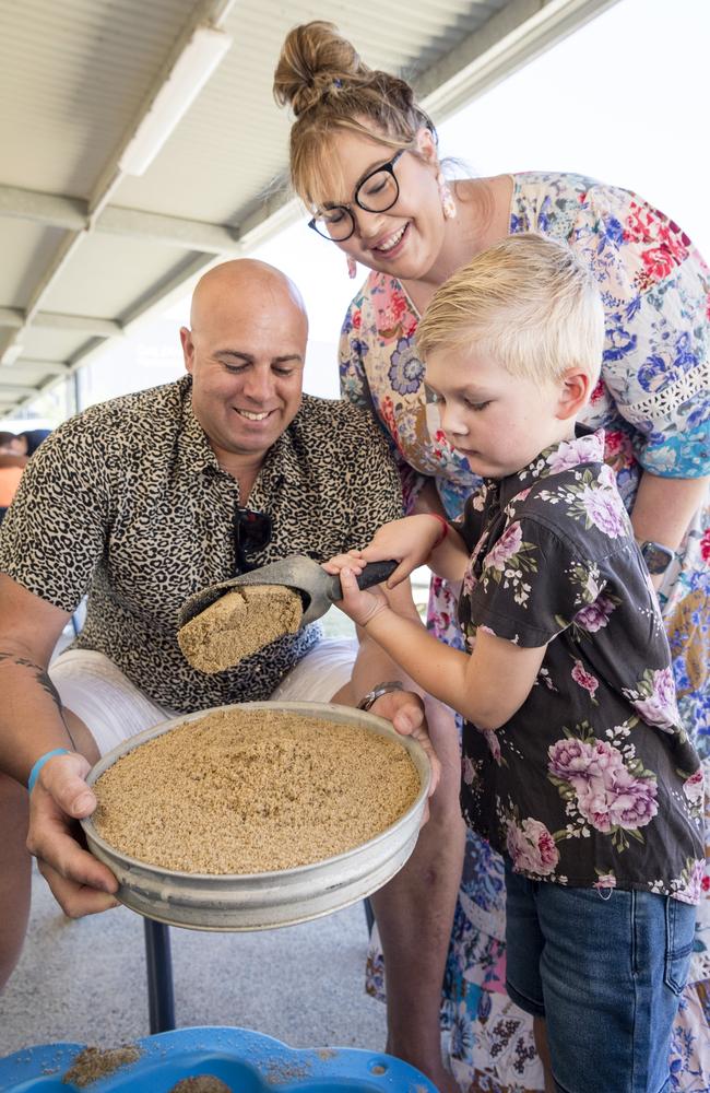 Onyx Mallyon fossicks with parents Joel and Jess Mallyon at Gemfest hosted by Toowoomba Lapidary Club at Centenary Heights State High School, Saturday, October 21, 2023. Picture: Kevin Farmer