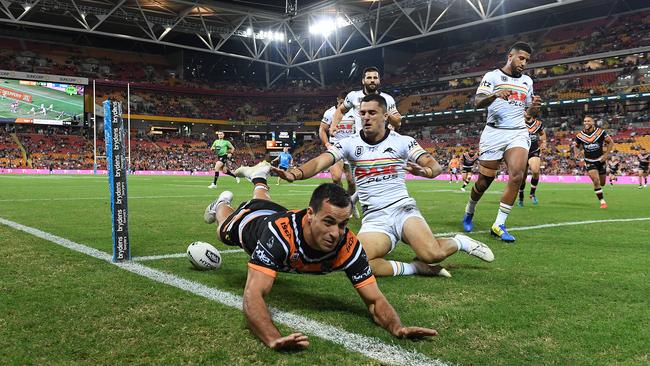 Corey Thompson of the Tigers scores a try during the Round 9 NRL match between the Wests Tigers and the Penrith Panthers at Suncorp Stadium in Brisbane, Friday, May 10, 2019. (AAP Image/Dave Hunt)