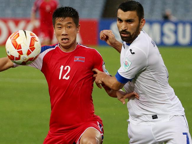 North Korea’s Om Chol Song takes on Uzbekistan’s Azizbek Haydarov.