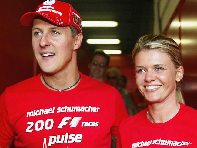 BARCELONA, SPAIN - MAY 9:  Michael Schumacher of Germany and Ferrari celebrates with his wife Corinna after competing in his 200th Grand Prix during the Spanish F1 Grand Prix on May 9, 2004, at the Circuit de Catalunya in Barcelona, Spain. (Photo by Getty Images)