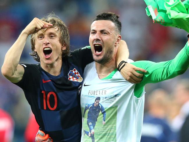 NIZHNY NOVGOROD, RUSSIA - JULY 01:  Luka Modric and Danijel Subasic of Croatia celebrate their victory following the 2018 FIFA World Cup Russia Round of 16 match between Croatia and Denmark at Nizhny Novgorod Stadium on July 1, 2018 in Nizhny Novgorod, Russia.  (Photo by Alex Livesey/Getty Images)