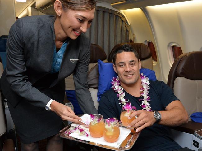 Jarryd tucks into a cocktail on the Sydney-Honolulu-Los Angeles flight.