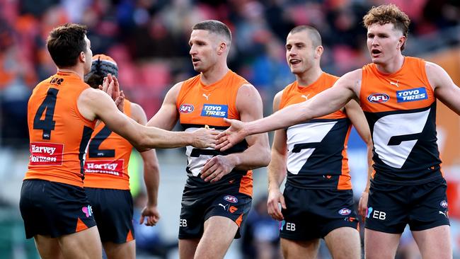 SYDNEY, AUSTRALIA - JULY 20: Jesse Hogan of the Giants celebrates kicking a goal with team mates during the round 19 AFL match between Greater Western Sydney Giants and Gold Coast Suns at ENGIE Stadium, on July 20, 2024, in Sydney, Australia. (Photo by Brendon Thorne/AFL Photos/via Getty Images)