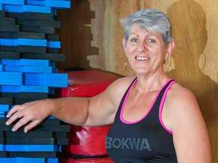 WAKE-UP CALL: Breast cancer survivor Catherine Hayter has lost a significant amount of weight  and now teaches the fitness class she says changed her life, Bokwa. Picture: Mike Richards GLA160818SURV