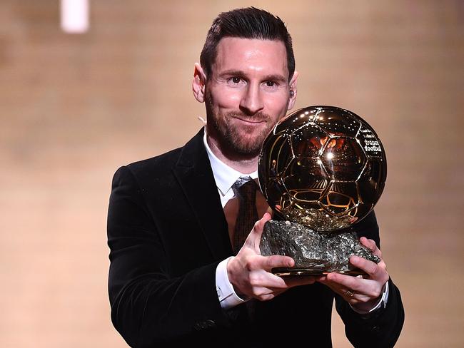 TOPSHOT - Barcelona's Argentinian forward Lionel Messi reacts after winning the Ballon d'Or France Football 2019 trophy at the Chatelet Theatre in Paris on December 2, 2019. - Lionel Messi won a record-breaking sixth Ballon d'Or on Monday after another sublime year for the Argentinian, whose familiar brilliance remained undimmed even through difficult times for club and country. (Photo by FRANCK FIFE / AFP)
