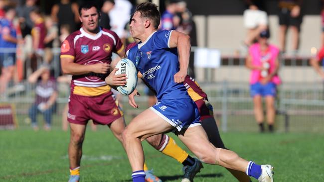 Hayden Buchanan takes a charge. Picture: Steve Montgomery Sports Photography