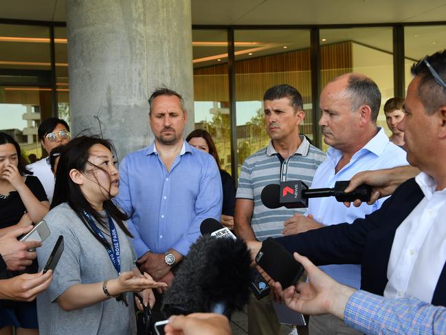 An upset resident (left) asks questions of Icon state director Julian Doyle at the press conference. Picture: AAP/Mick Tsikas