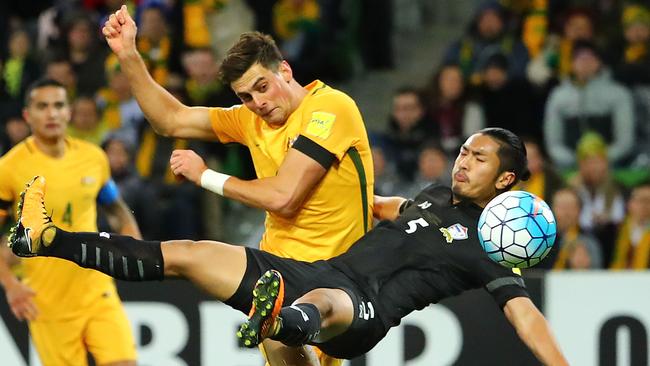 Socceroos striker Tomi Juric has his shot deflected by Thai defender Adison Promrak on Tuesday night