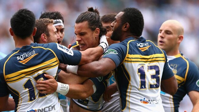 SYDNEY, AUSTRALIA - MARCH 22: Matt Toomua of the Brumbies celebrates scoring a try with team mates during the round six Super Rugby match between the Waratahs and the Brumbies at Allianz Stadium on March 22, 2015 in Sydney, Australia. (Photo by Cameron Spencer/Getty Images)