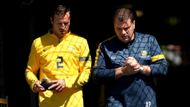 Lucas Neill and Ange Postecoglou in late 2013.