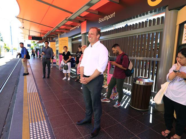 Queensland Premier Steven Miles pictured waiting for a tram in Southport on the last day of the election campaign. Picture: Adam Head.