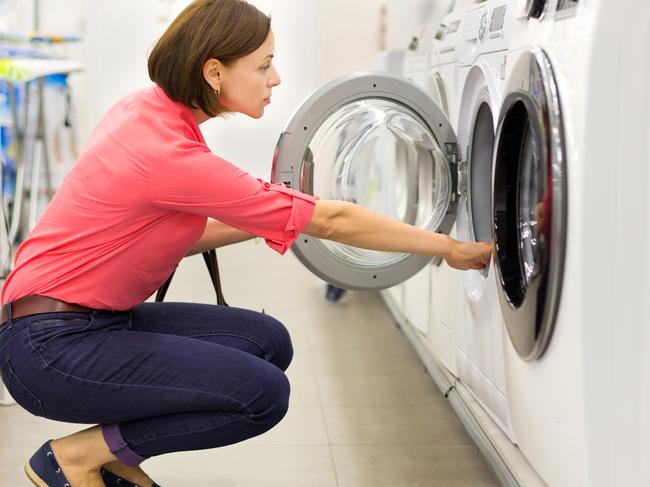 A woman shopping for a washing machine in a store. Picture: iStock.