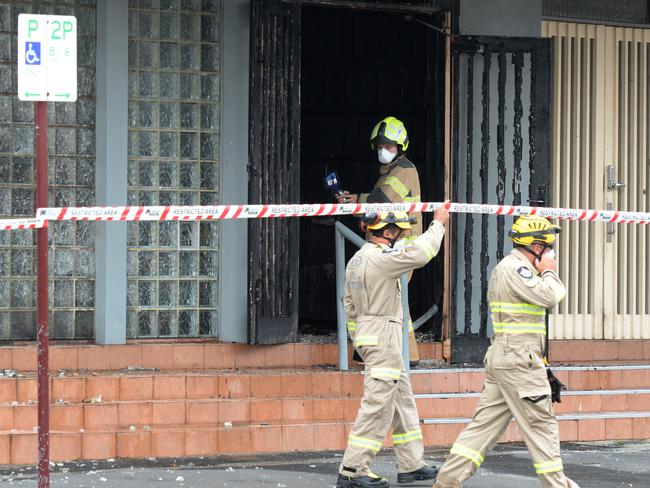 Police and fire crews inspect the synagogue after the early-morning blaze. Picture: Andrew Henshaw