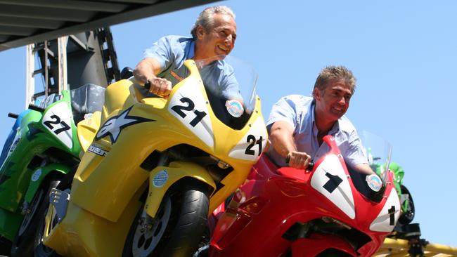 CEO Stephen Gregg (L) and five-time 500cc motorcycle world champion Mick Doohan on motocoaster ride at Dreamworld on Gold Coast.